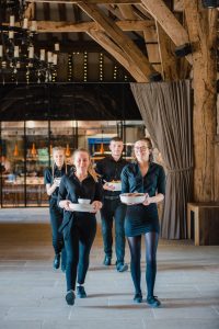 waiters walk from kitchen