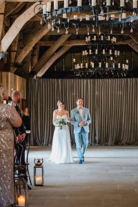 bride and dad walking down the aisle