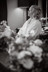 balck and white image of the bride getting ready