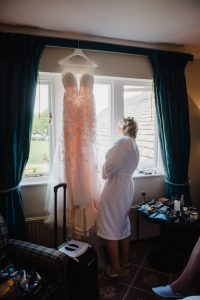 bride peeps at guests outside
