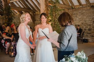 laughing bride during wedding service