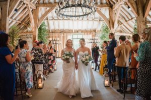 brides newlyweds walk back down the aisle