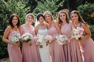 sisters and daughters cuddle up at the wedding