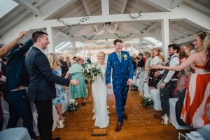 married couple walk out of ceremony