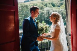 newlyweds looking out from visitors centre