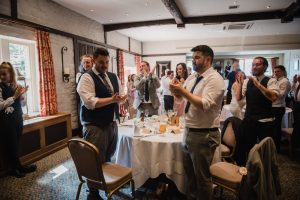 newlyweds walk into to the wedding breakfast