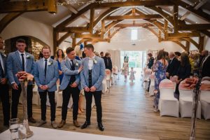 the flower girls walk down the aisle