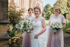 bride and bridesmaids arrive at the church