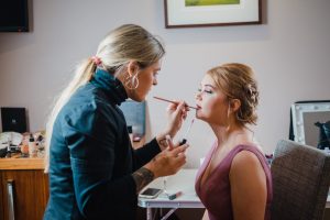 Bex Gait applying makeup