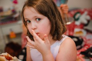 flower girl eating bacon sandwich