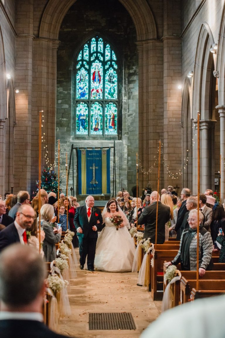 dad and bride come down the aisle