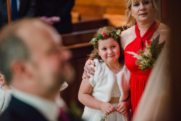 flower girl is emotional watching mum and dad get married