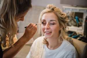bride having her eye makeup applied