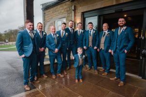 all the groomsmen posing for the camera