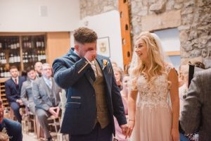 groom getting emotional when greeting his bride