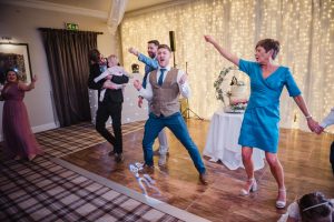 groom and mum dancing at the wedding evening party