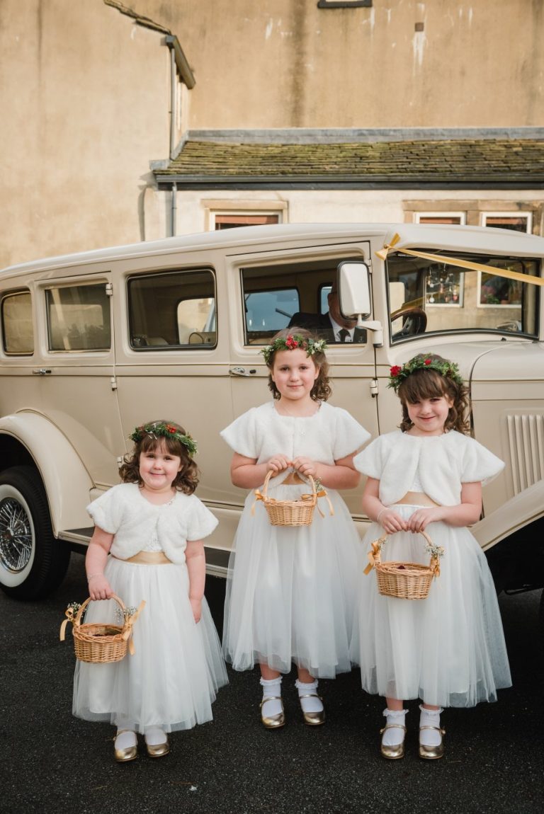 bridesmaids and car