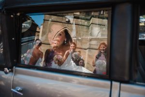 reflection shot of bridesmaids and bride