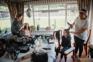 bride and flowergirl getting ready
