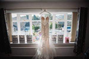 brides dress by window