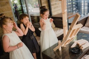 kids playing jenga at wedding