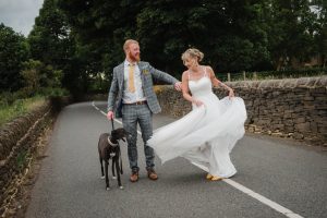 dog and bride and groom at wedding