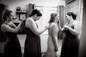 black and white of bridal preparations with bridesmaids