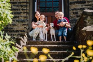 family on doostep of their home in lockdown Marsden