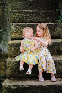 captured moment of sisters laughing together
