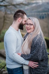 couple with Huddersfield views behind