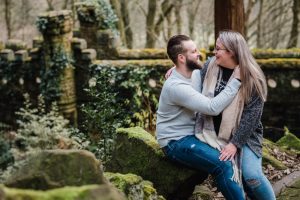 engaged bride and groom to be in front of castle wall
