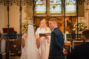 groom looks around to guests