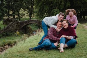 family hugging near Eastergate bridge