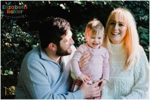 baby and parents giggling