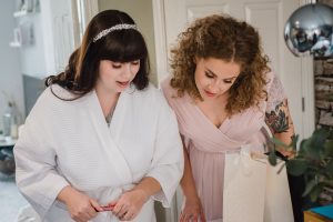 bride getting ready in the morning before the wedding at The Fleece Inn