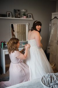bride getting ready in the morning before the wedding at The Fleece Inn