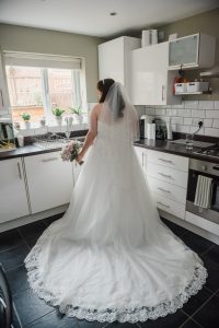 bride in her gown at home