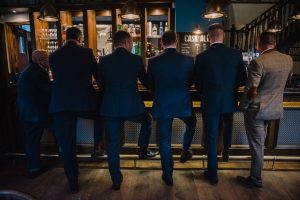 the groomsmen wait interior shot of the pub
