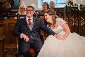seated image of the bride and groom in Dobcross church