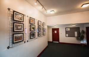 Interior shot of Marsden Mechanics Hall showing lobby area with gallery wall