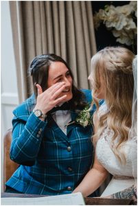 bride wipes away a tear