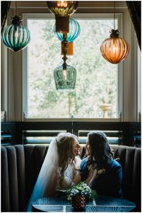 newlyweds in the bar area at manor house