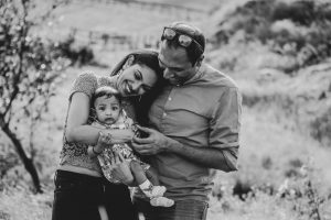 black and white images of new parents and baby