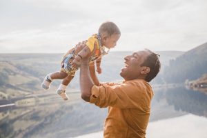 dad and baby with picturesque backdrop