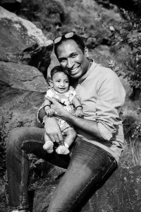 black and white photo of dad and child in the sun