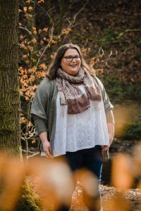 writer Charlotte Furness in Slaithwaite Huddersfield headshot with foliage