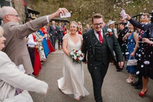 confetti being thrown at the newlweds