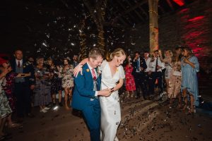 confetti on the bride and groom during the first dance