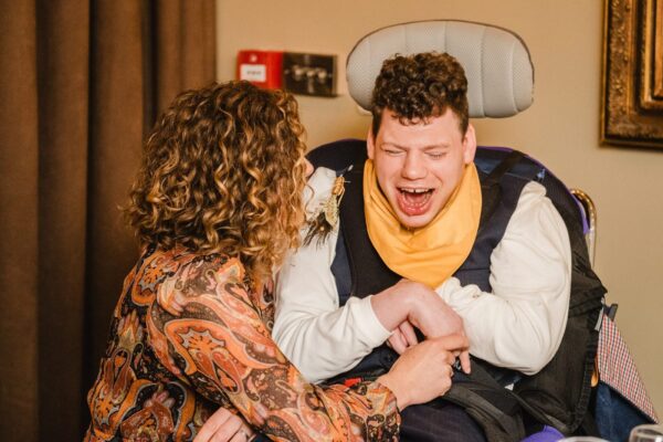 Guests laugh at the wedding