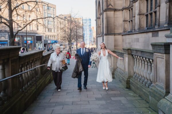 bride and parents arrive at Sheffield Town Hall for the wedding